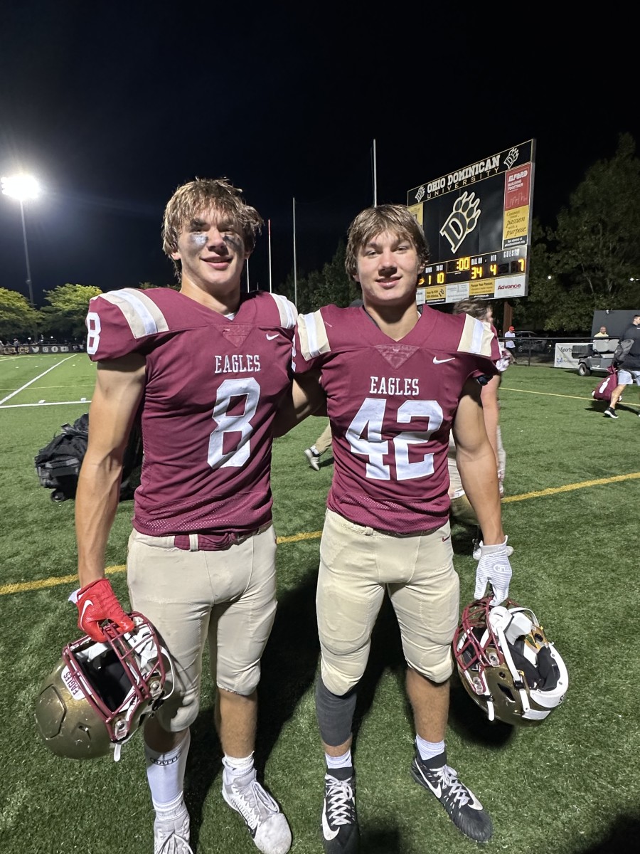 Jake and Ben Uhlenhake pose together following a Bishop Watterson football game.
